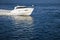 White motor boat sailing in calm water