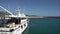 White motor yacht moored at the pier of Lustica bay