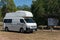 White motorhome, campervan vehicle parked at information sign at Fogg Dam