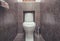 White mounted toilet bowl in modern bathroom