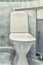 White mounted toilet bowl in modern bathroom