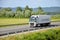 White moving Volvo truck coupled with semi-trailer located on slovak D1 highway.