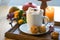 White mug with chocolate hot drink and melting marshmallows, muffins, candle and autumn decoration on a table, copy space,