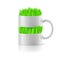 White mug with insertion of grass