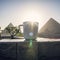 White mug with tea or coffee on beautiful background of the main attractions of Egypt, the Great pyramids of Giza