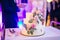 White multi stage wedding cake decorated with flowers