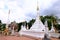 The white Myanmar Pagoda in front of ancient Thai style ordination hall at Nonthaburi, Thailand December 2018