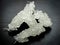 White nabat with black background , Iranian rock candy on a wooden table
