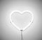 White neon light heart icon on grey background. Ready for  greeting card