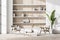 White niche shelf, woode details, armchairs with indoor plant in seating area