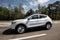 White nissan qashqai crossover side view in motion