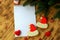 White notebook for Christmas wishes, goals, recipes for the New Year 2021, gingerbread cookies in form of Santa Claus hat, hearts