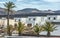 a white oasis with the volcanic mountains of lanzarote in the background