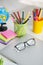 White office desk table with school accessories with office supplies.