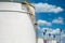 White oil storage tanks at petrol industrial zone, Industrial oil tanks in a refinery, White fuel storage tank against blue sky