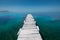 White old wooden pier on the seashore on a beautiful sunny day. Corfu Greece