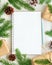 White open notepad, bullet journal for wish list and Christmas decoration on white wooden background, flat lay, copy space. Hand