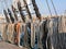 White, orange and black ropes dry on the rail on a sailing ship on a Sunny summer day. The rigging of a sailboat.