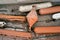 White and orange buoys lie on the shore