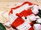 White and orange knit sweater and decoration on wooden background