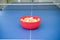 White and orange ping pong ball on ping pong table