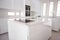 White organised kitchen with modern elements in an apartment