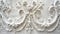 White ornamental plasterwork detail on a wall