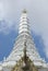 White ornate tower of buddhist temple Wat Phra Kaew, Bangkok