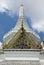 White ornate tower of buddhist temple Wat Phra Kaew, Bangkok