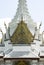 White ornate tower of Temple of the Emerald Buddha Wat Phra Kaew, Bangkok