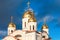 White orthodox church with golden domes