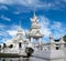 White pagoda and bridge at Wat Rong Khun buddhist temple complex in Chiang Rai, Thailand