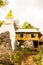 White pagoda and building on mountain at Chaloemphrakiat Prajomklao Rachanusorn temple