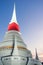 White pagoda in Wat Phra Samut Jedi under evening sky