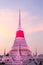 White pagoda in Wat Phra Samut Jedi under evening sky