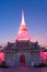 White pagoda in Wat Phra Samut Jedi under evening sky