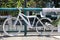 White painted Bike with Shoes on Racamalac Bridge over River Mapocho. Santiago de Chile