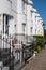 White painted Grade II listed Georgian town houses in the Guildford Lawn conservation area, in Ramsgate, Kent UK.