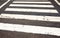 White Painted Lines On Roadway Denoting Pedestrian Crossing