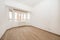 White painted room with stoneware floor like wood with curved window