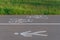 White painted signs of pedestrian lane and bicycle lane on asphalt road