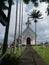 White painted small church against stormy sky