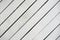 White painted wooden surface close-up. Rustic natural wooden diagonal planks with cracks, scratches for modern design