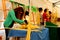 White palm female sellers at several street stalls during Easter Holidays in Elche city, Spain