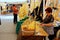 White palm female sellers at several street stalls during Easter Holidays in Elche city, Spain