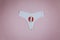 White panties and tampon indicating the arrival of menstruation