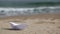 White paper boat on the beach