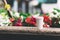 White paper cup with coffee on the street on a background of blurry colors.