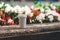 White paper cup with coffee on the street on a background of blurry colors.