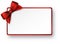 White paper gift card with red satin bow.